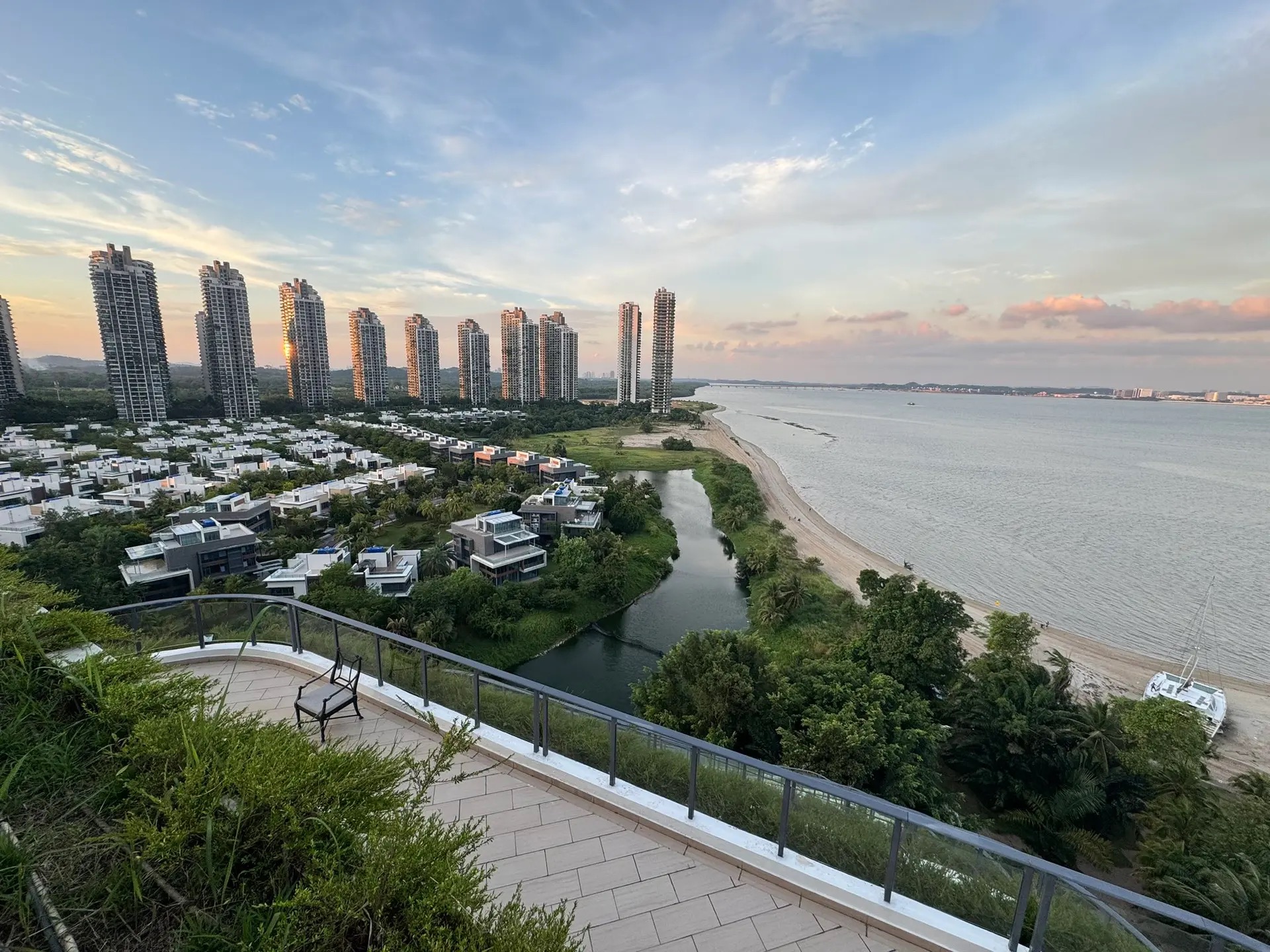 A coastal view from Network School near Singapore at sunset.